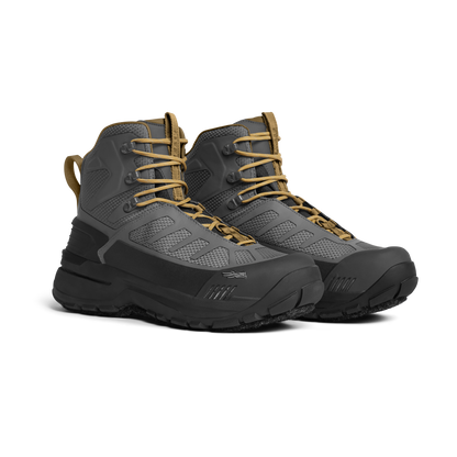 Pair of gray and black hiking boots with tan laces on a white background