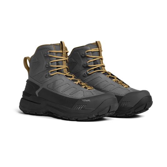 Pair of gray and black hiking boots with tan laces on a white background
