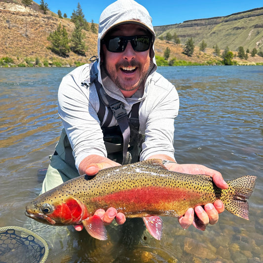 Anlger holding Deschutes River Rainbow Trout