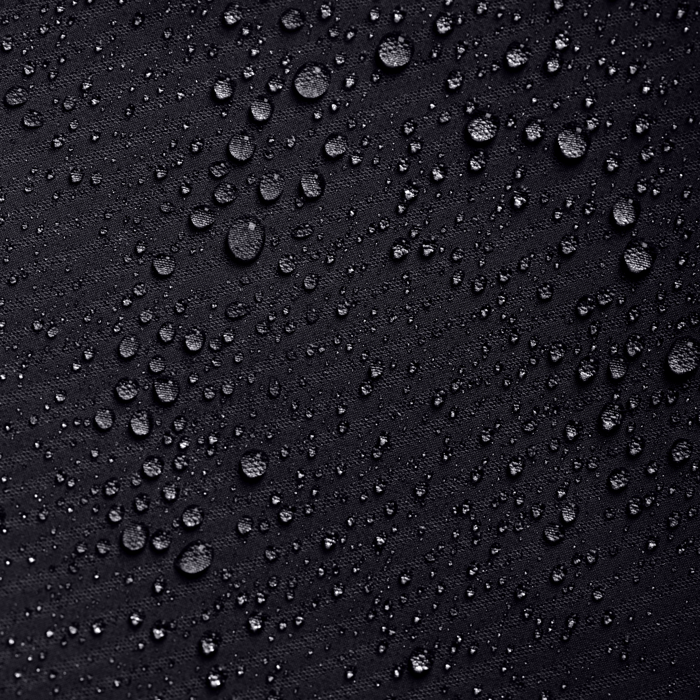 Close-up of water droplets on a black surface