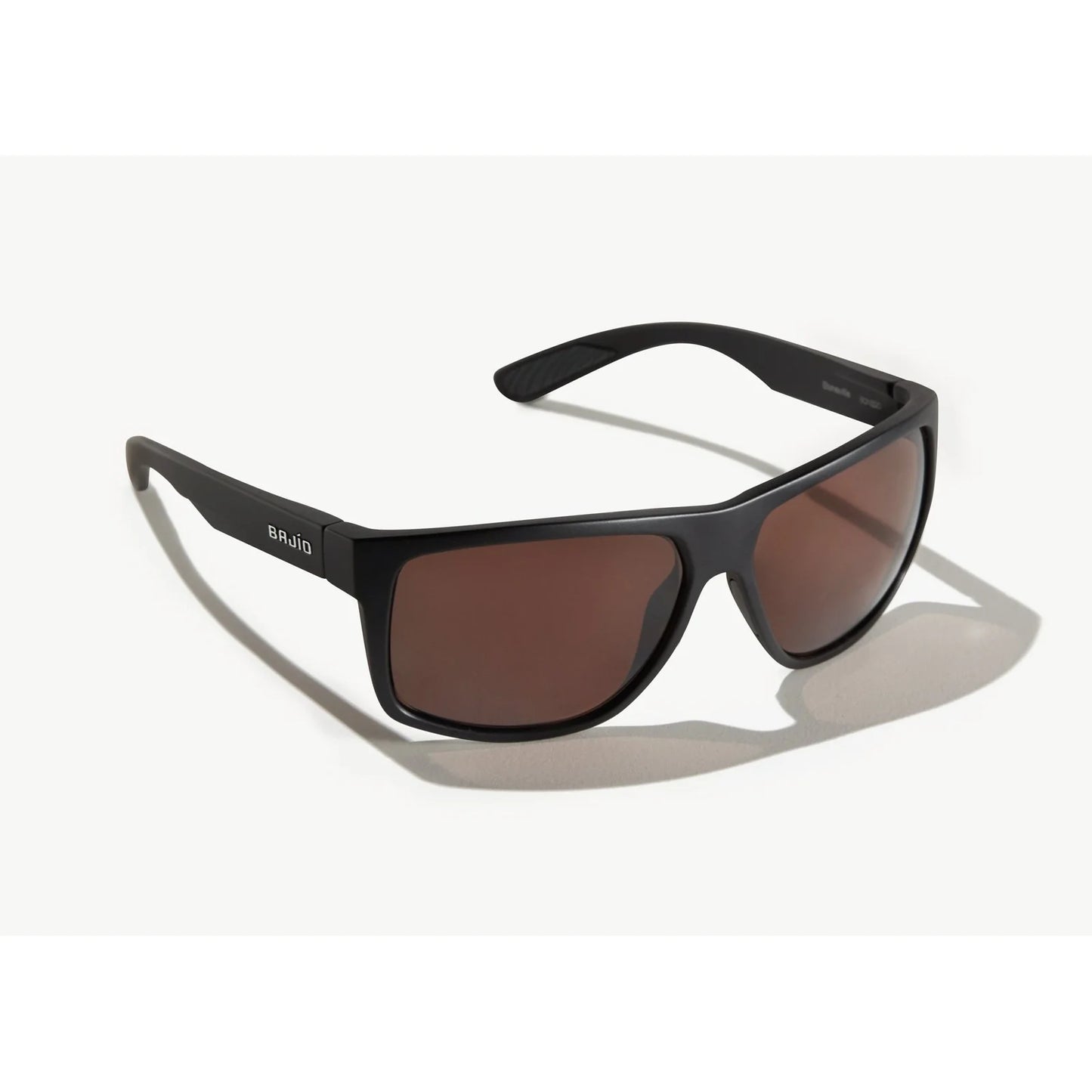 Black sunglasses with brown lenses on a white background