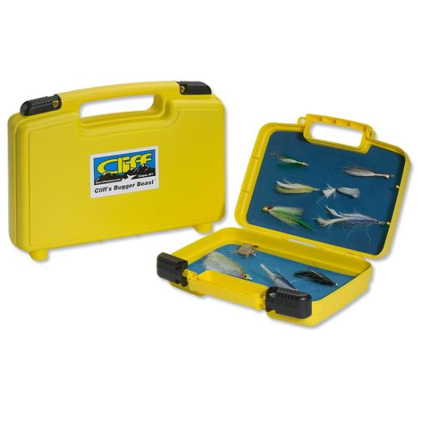 Hands selecting flies from a yellow Bugger Beast Jr. fly box packed with colorful streamer patterns.