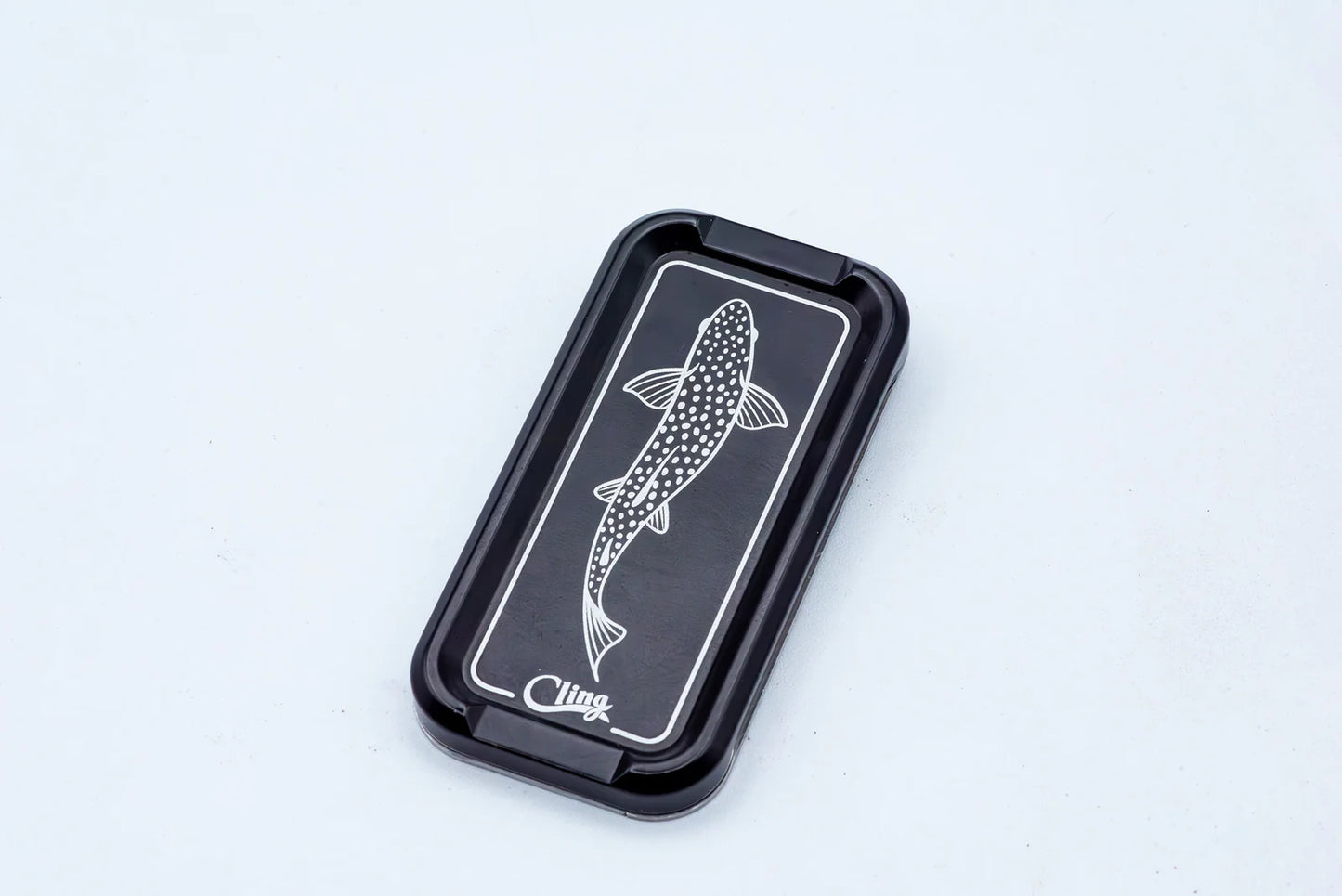 Cling Mag Grab Double Stack in matte black featuring a white etched trout design on a sleek metal base.