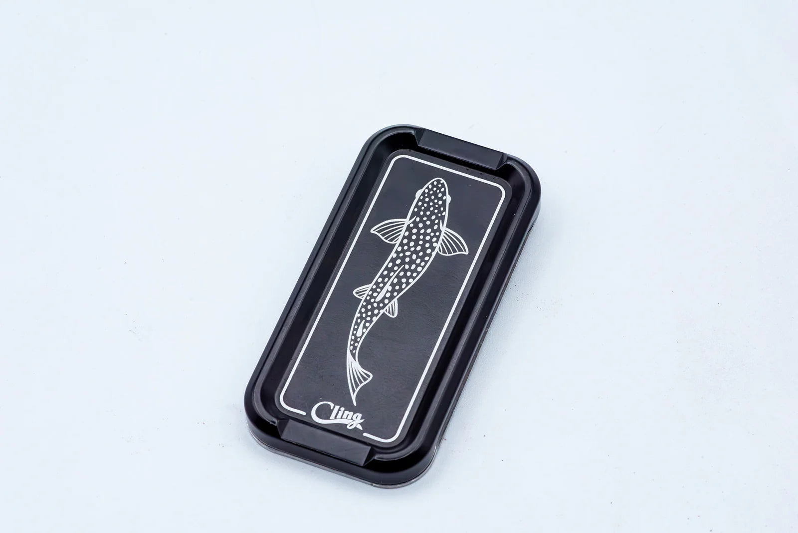Cling Mag Grab Double Stack in matte black featuring a white etched trout design on a sleek metal base.