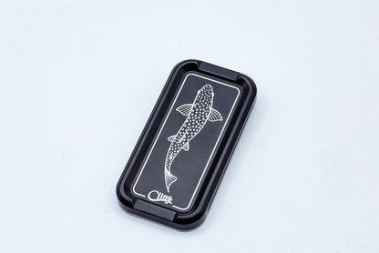 Cling Mag Grab Double Stack in matte black featuring a white etched trout design on a sleek metal base.