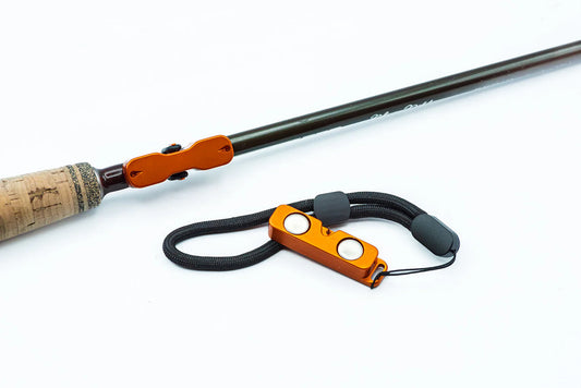 Orange Cling Rod Rack Set attached to a rod with matching magnetic leash.