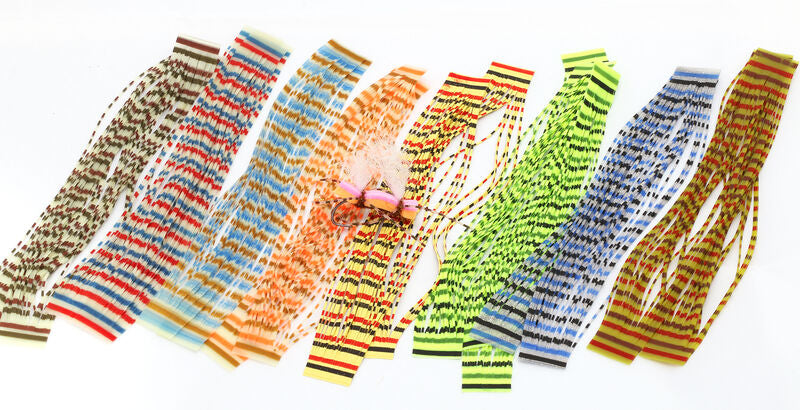 assorted triple barred heavy duty silicone legs by Hareline in various vibrant colors laid out in a fan shape.