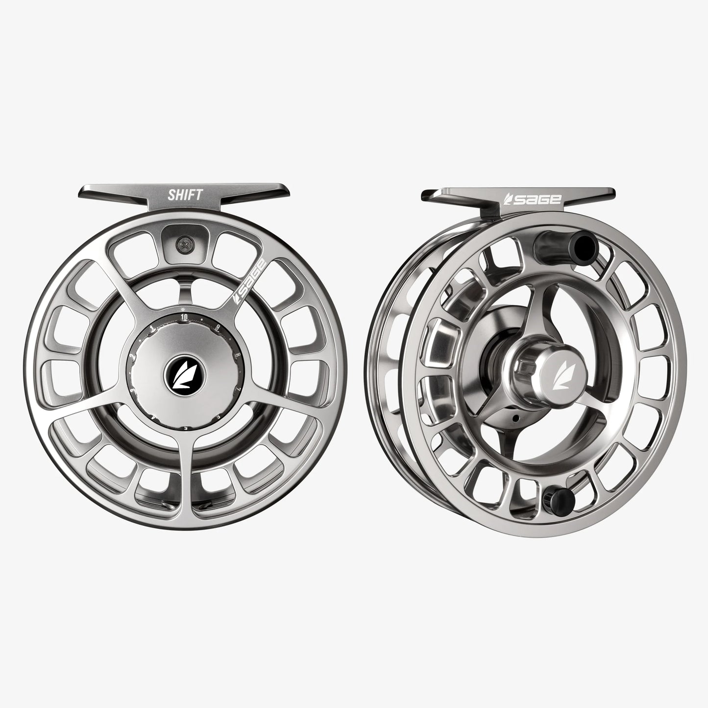 Two silver fishing reels on a white background