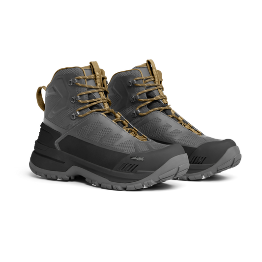 Pair of gray and brown hiking boots on a white background