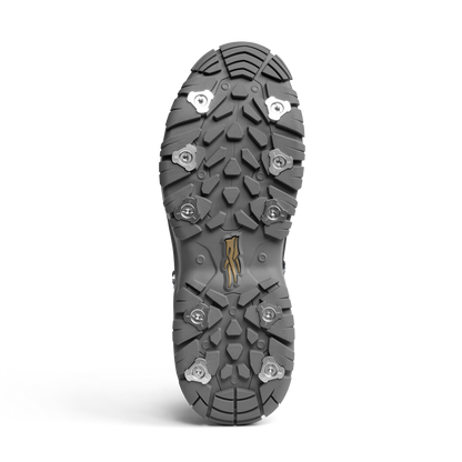 Close-up of a shoe sole with cleats on a white background