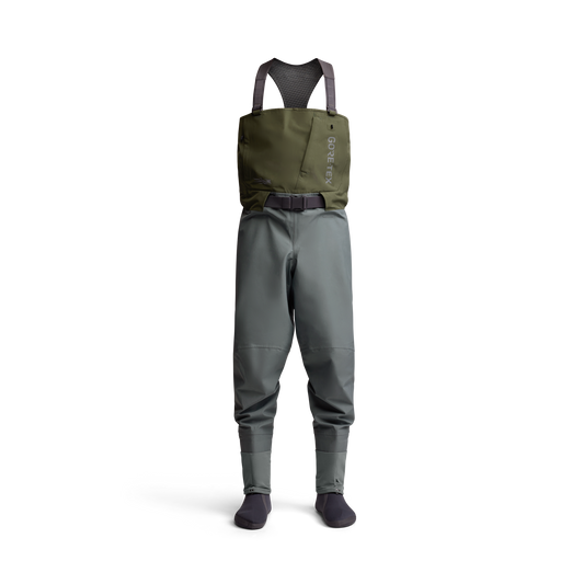 Full view of the Sitka Crosscurrent GTX Stockingfoot Wader standing upright with belt and shoulder straps visible.