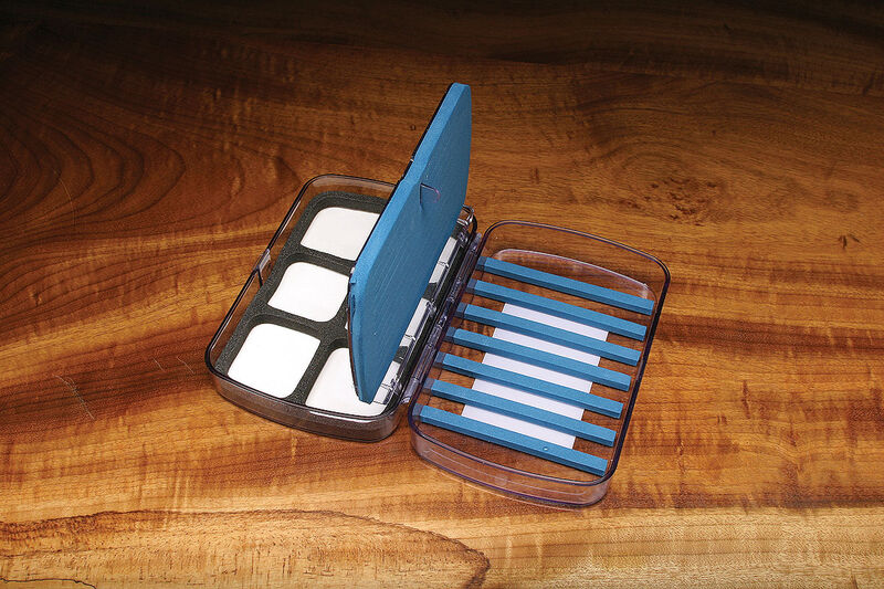 Open Super Days Worth fly box showing multiple fly compartments and a central flip insert for organized fly storage.