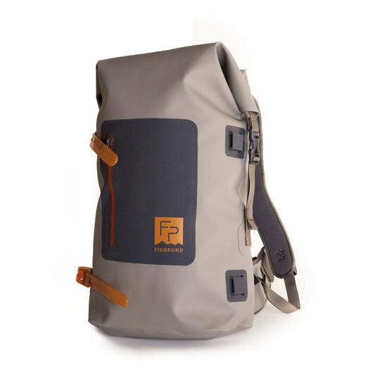 Front view of the Fishpond Wind River Roll-Top Backpack with logo, waterproof zipper, and rugged exterior.